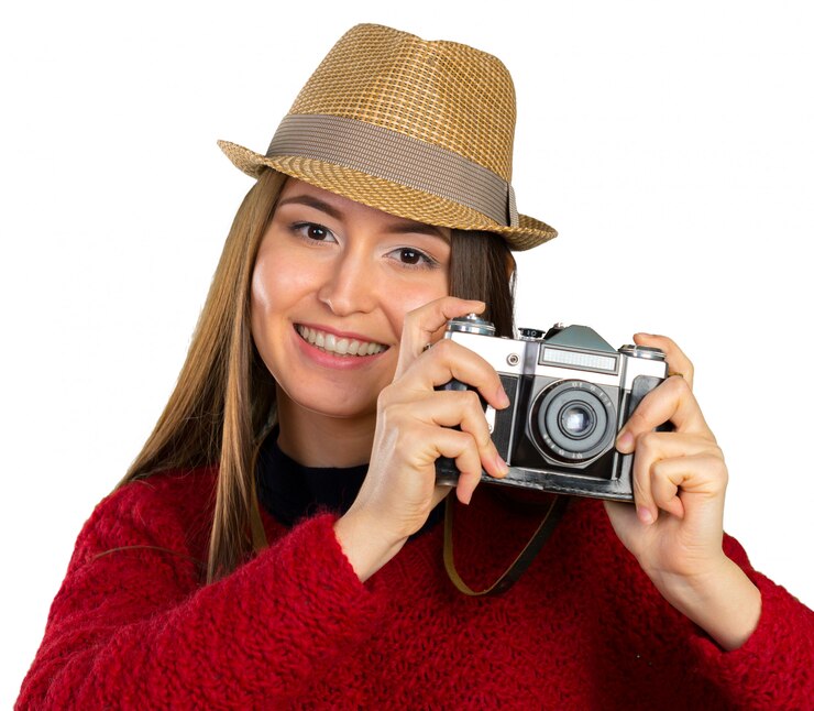 cheerful-young-woman-with-camera_93675-22281